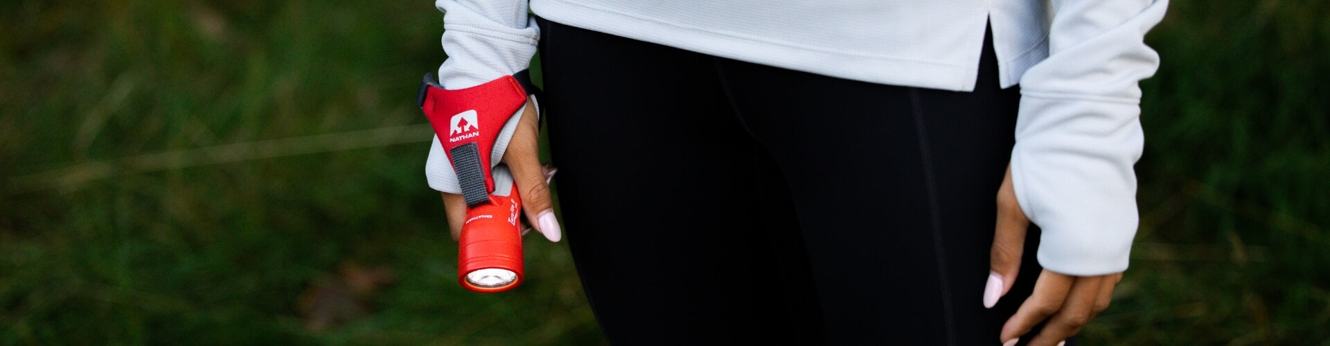 Runner Holding Handheld Flashlight