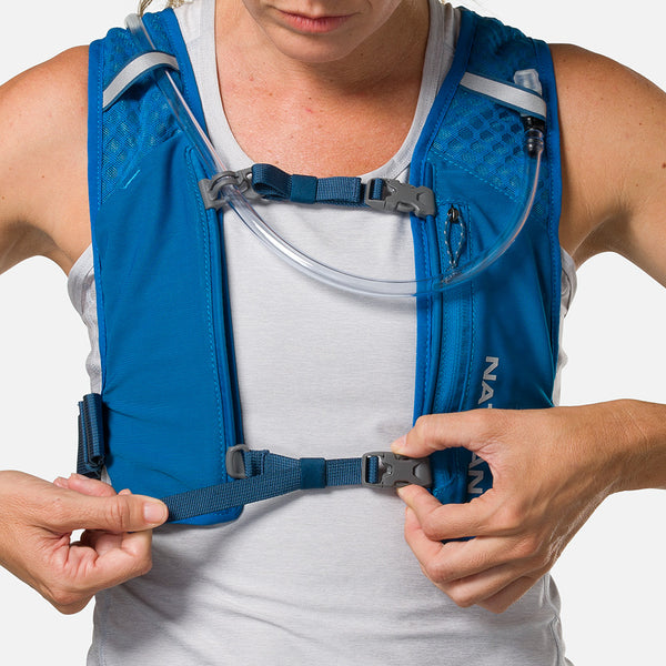 color:Deep Blue/Reflective Silver
||seo:Nathan QuickStart 3.0 3 Liter Hydration Pack - Deep Blue/Reflective Silver - On Model - Model Tightening Sternum Straps For Better Fit-primary