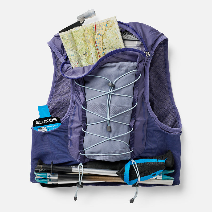 color:Indigo/Light Blue||seo:VaporAiress 4.0 8 Liter Women's Hydration Pack - Indigo/Light Blue  - Showcasing Multiple Back Pockets That Can Be Used For Maps, Energy Gels, and Pole Keepers