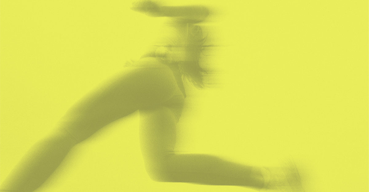 Motion-blurred silhouette of a runner mid-stride against a bright neon yellow background.